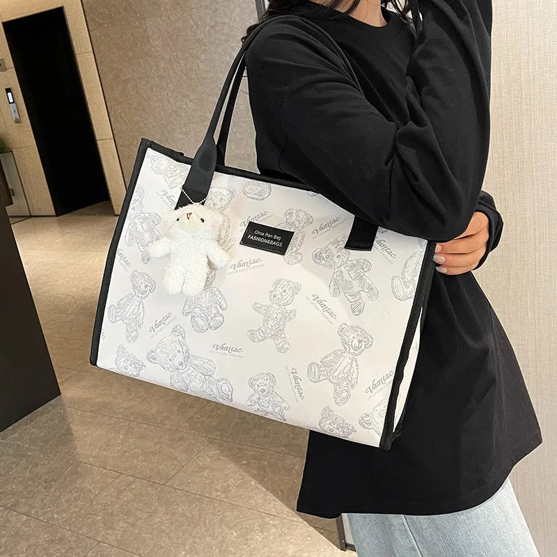 Women's large capacity canvas tote bag with rhombus pattern and sandwich pocket in black or white