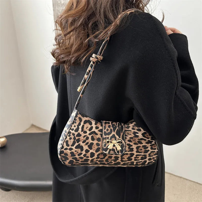 Women's casual large black PU shoulder bag with a sandwich pocket, shown next to brown and khaki colour options.