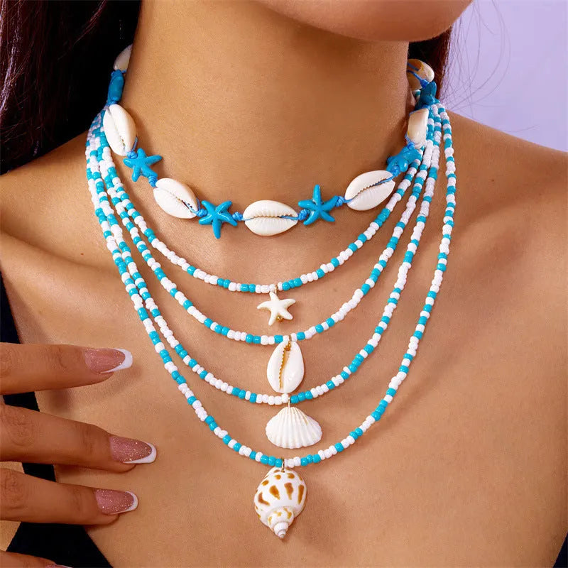 Women's five-piece shell bead necklace set with adjustable length showing blue and coloured variants
