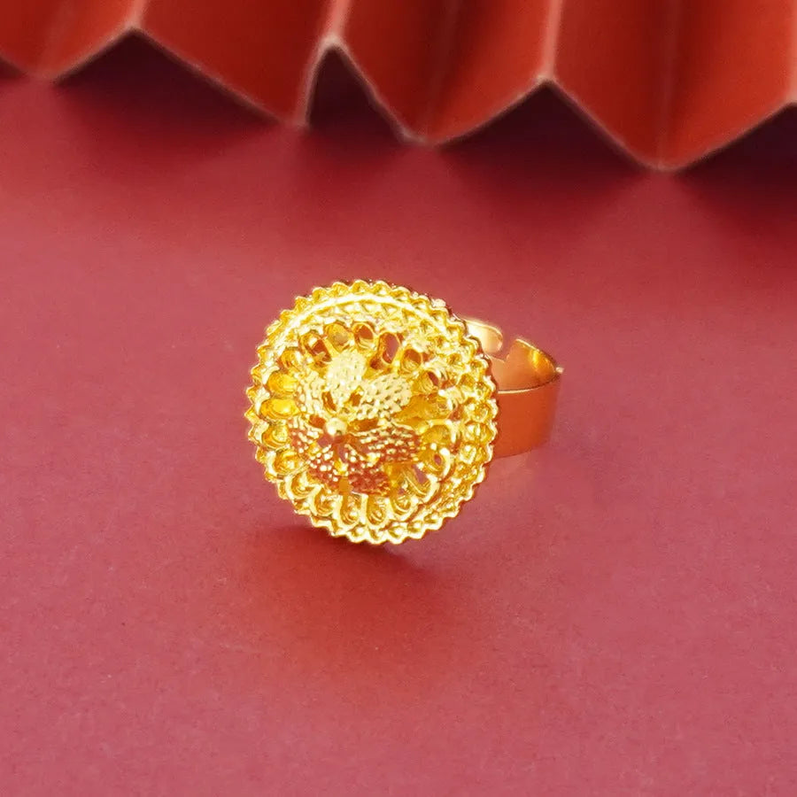 Three-piece gold-plated jewellery set with floral design including pendant necklace, earrings and ring
