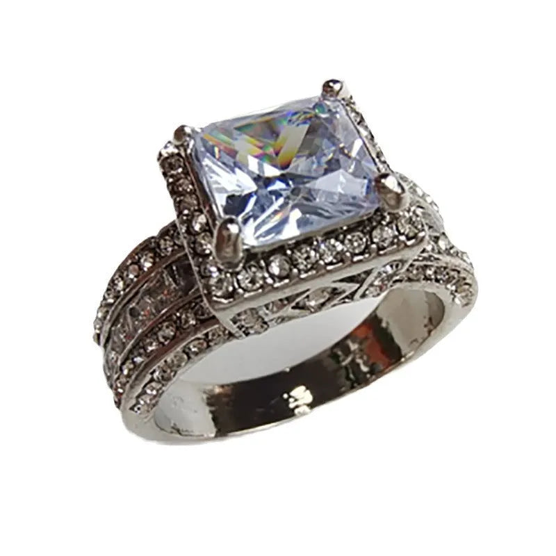 Silver-plated geometric women's ring in gold or white electroplated finish showing angular design with round elements