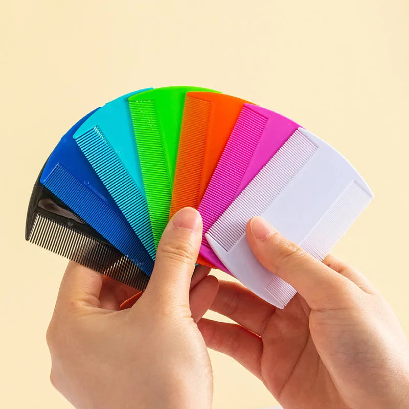 Double-edged fine-toothed plastic flea and lice comb in multiple colours on white background