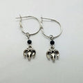Silver round earrings with Tibetan antelope design inspired by Yunnan high altitude regions