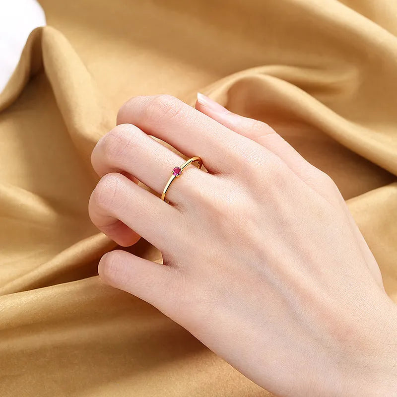 Copper fine circle ring for women with a single diamond, shown in blue, green, red, and white colour options.