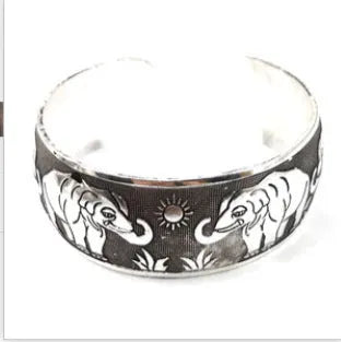 Carved open Miao silver alloy bracelet in Elephant and Turtle colour options with Roman shape