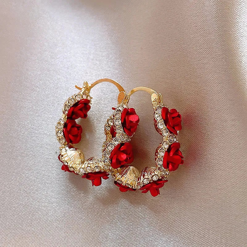Red alloy clip-on earrings with flower shape and rose-inspired design for women