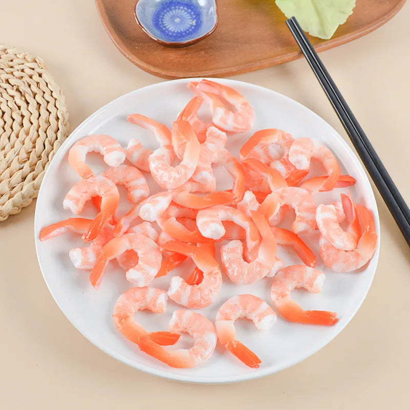 Solid PVC shrimp-shaped keychain with metal loop, 1.5cm thick, modern design.