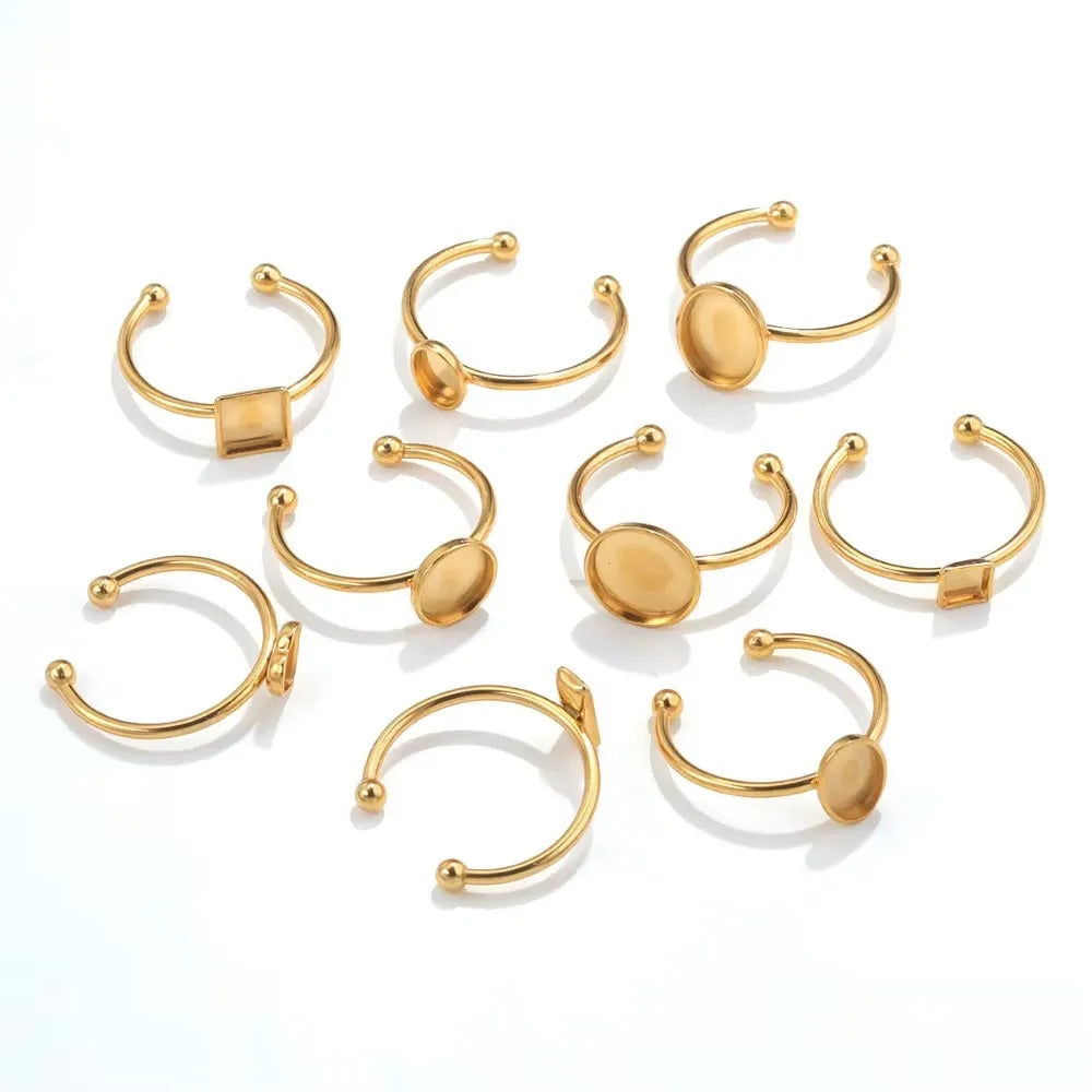 Golden stainless steel ring setting with totem pattern for DIY jewellery making, shown with a ring holder.