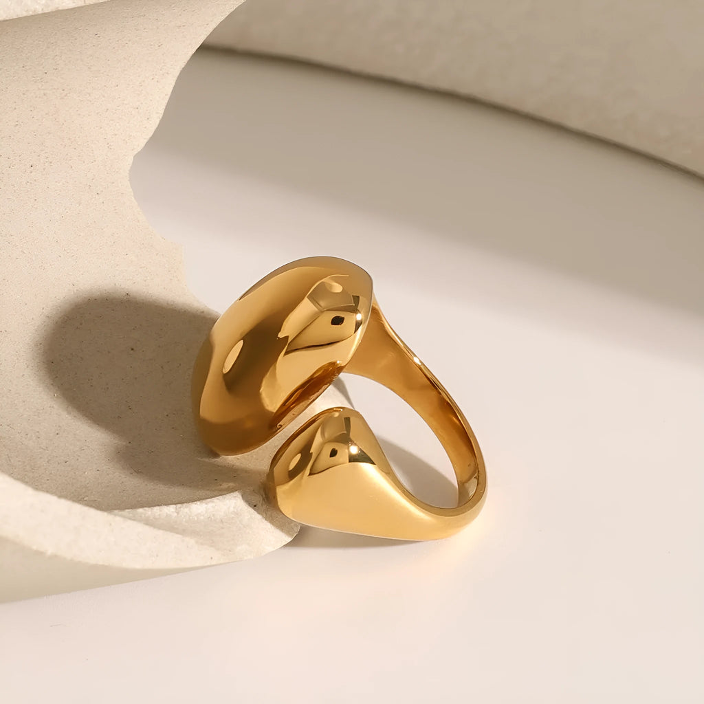 Exaggerated geometric stainless steel open ring for women with electroplated finish.