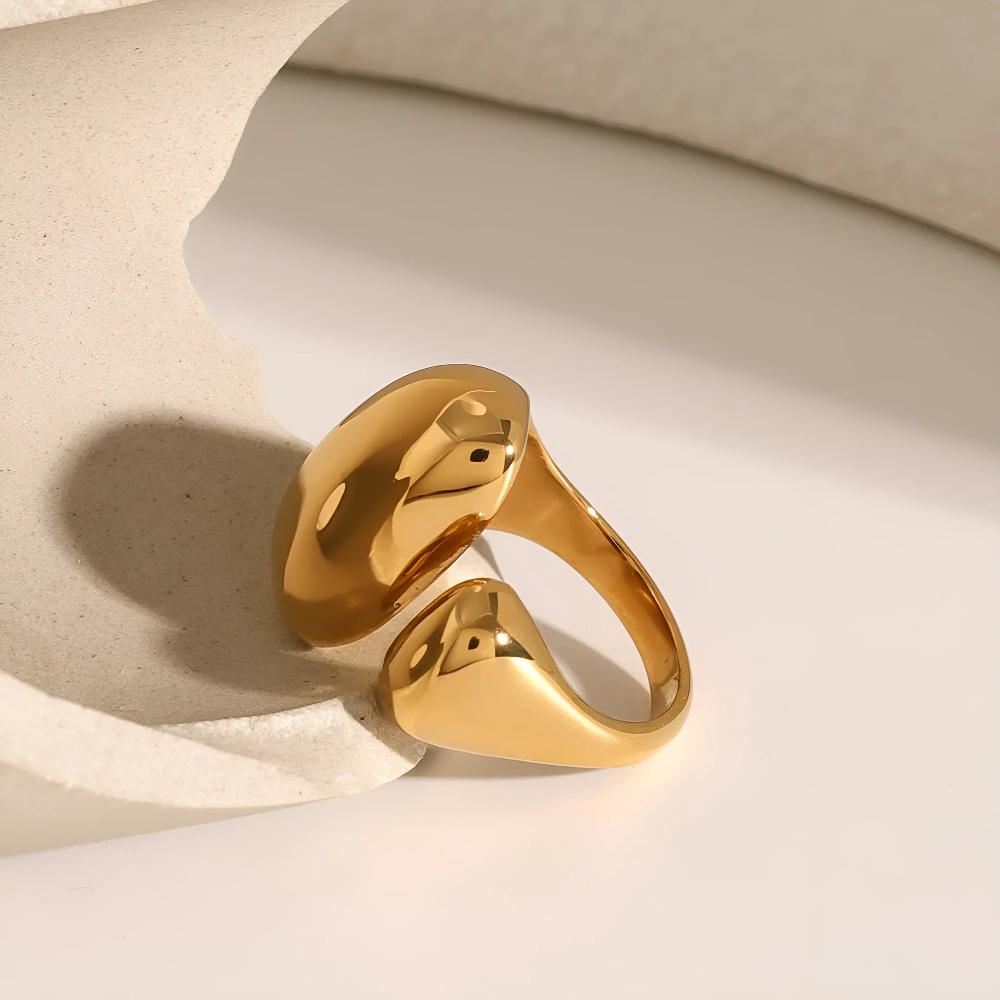 Exaggerated geometric stainless steel open ring for women with electroplated finish.