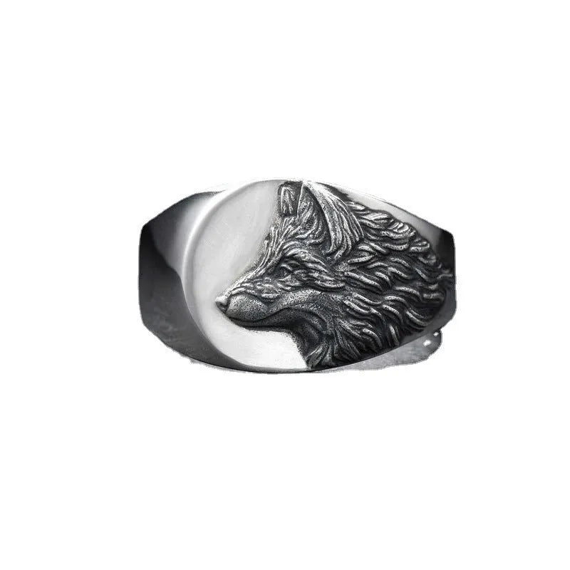 Geometric wolf head alloy signet ring in silver colour on a solid background