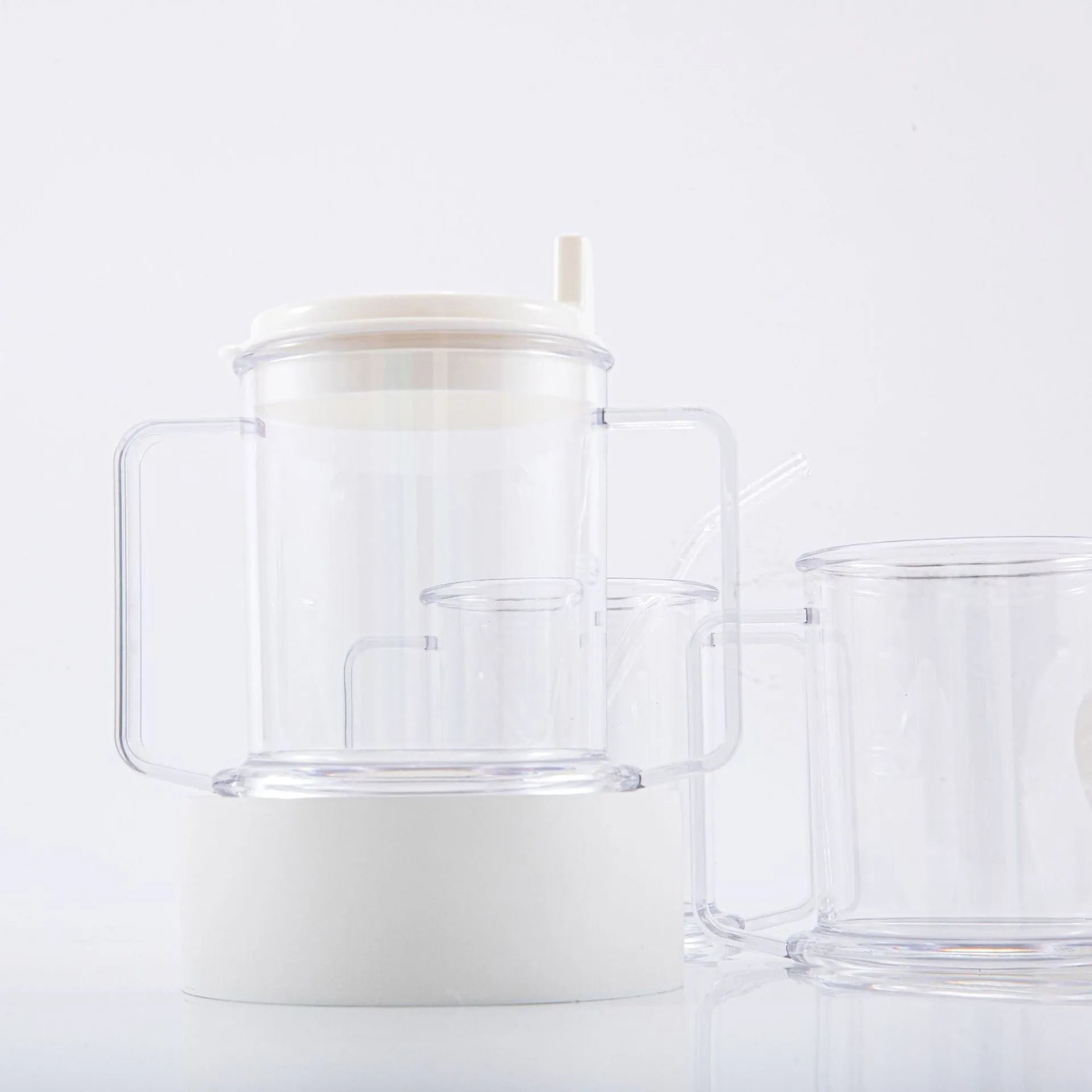 Transparent spill-proof drinking cup with modern design measuring 14cm tall