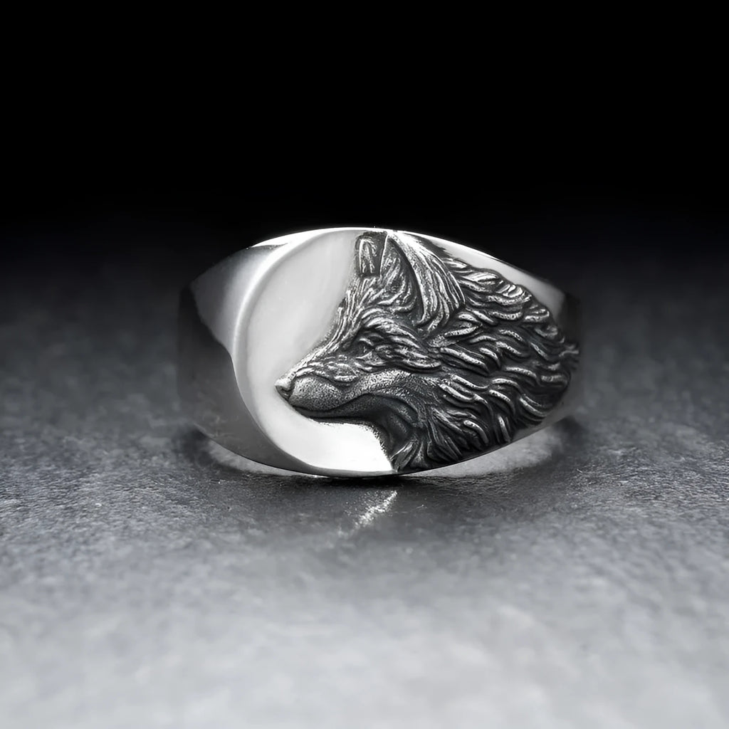 Geometric wolf head alloy signet ring in silver colour on a solid background