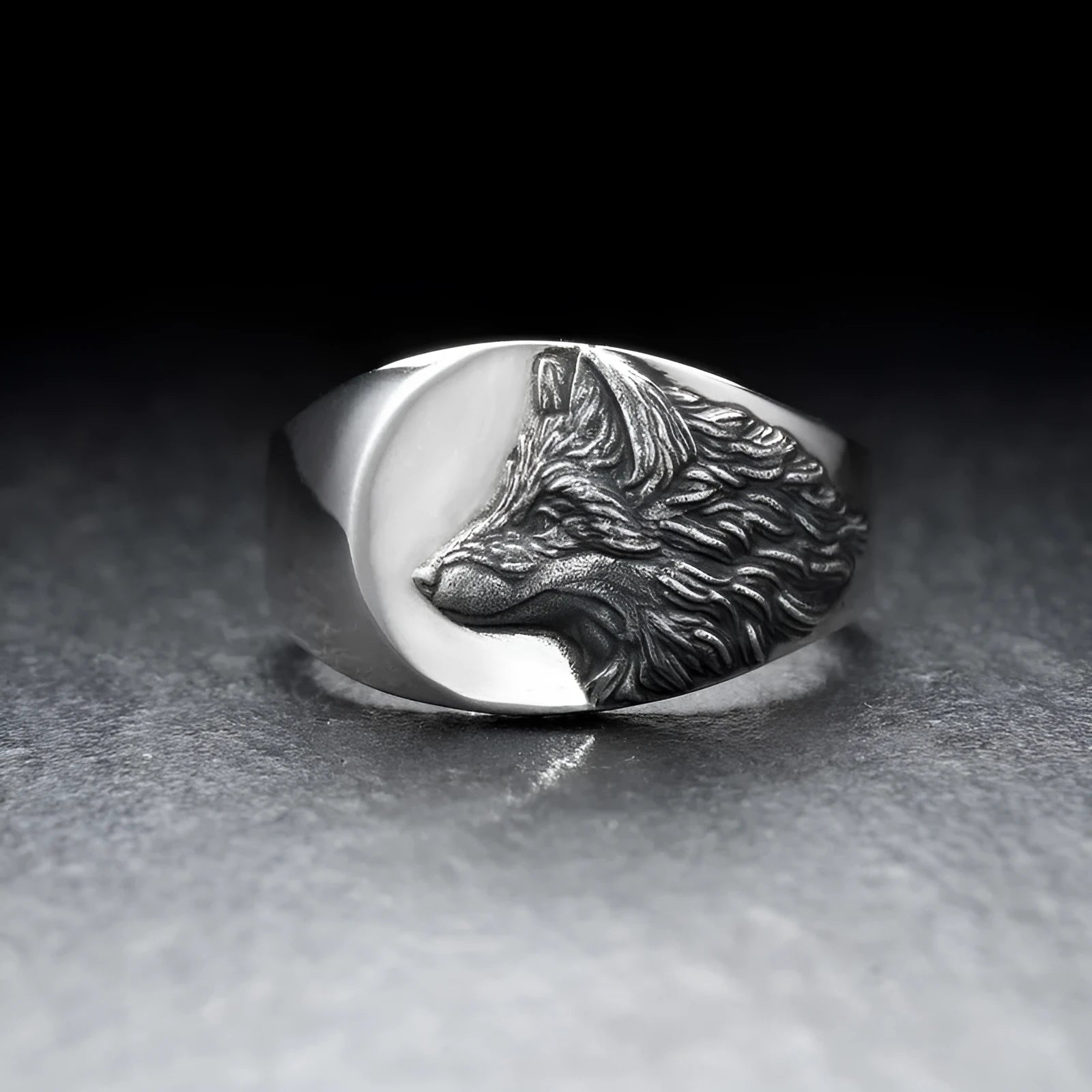 Geometric wolf head alloy signet ring in silver colour on a solid background