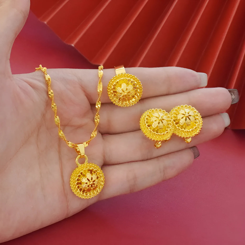 Three-piece gold-plated jewellery set with floral design including pendant necklace, earrings and ring