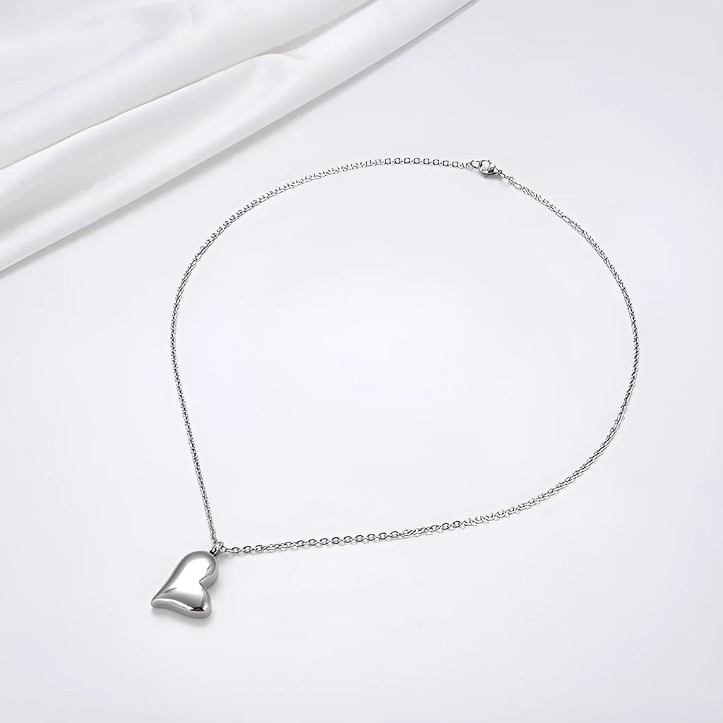 Silver curved peach heart stainless steel pendant necklace on adjustable chain