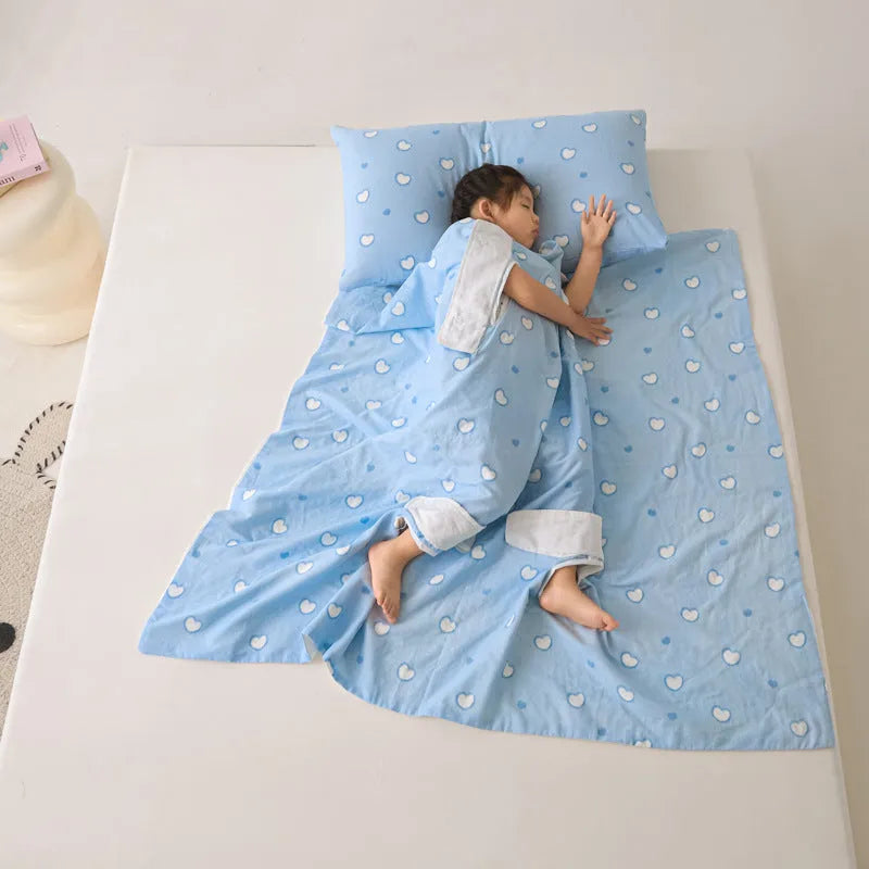 Light blue anti-kick summer blanket with antibacterial filler on a bed