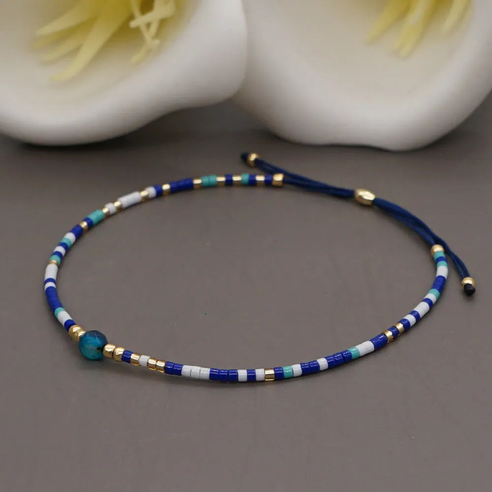 Bohemian style women's bracelet with semi-precious stone and colourful glass beads on adjustable fastening