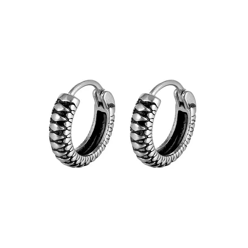 Silver titanium steel geometric twist earrings with round sports-style elements
