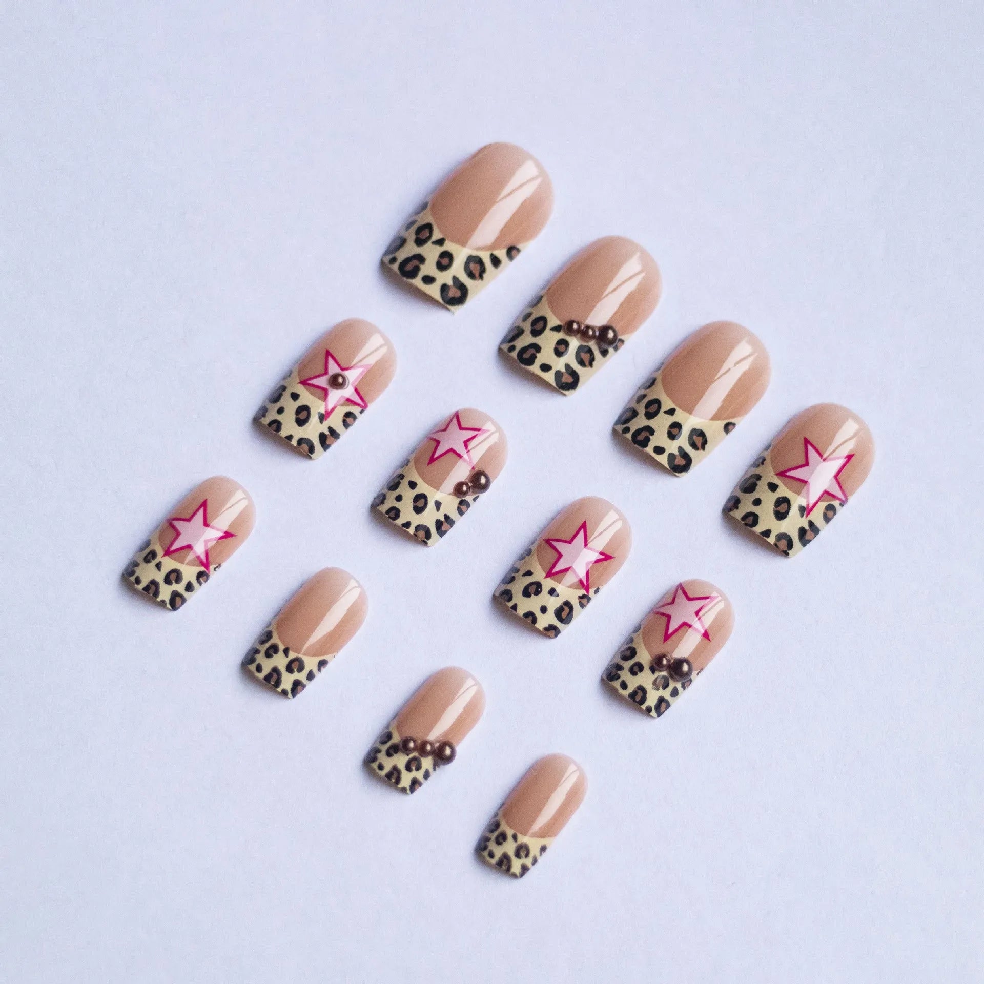 Wear Armor French leopard print five-pointed star press-on nails with pearl and diamond accents