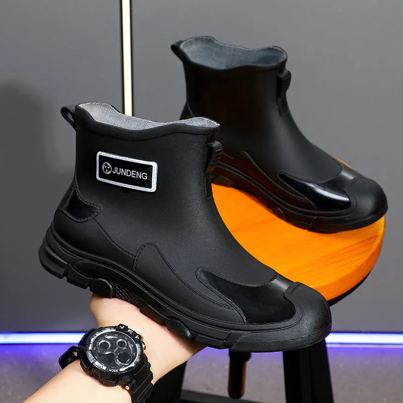 Solid colour low tube PVC rain boots with flat heel and round toe, integrated moulding sole, available in black, black and yellow, khaki