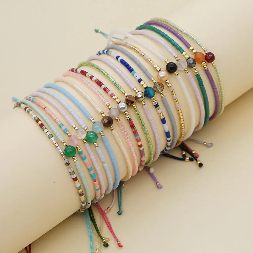 Bohemian style women's bracelet with semi-precious stone and colourful glass beads on adjustable fastening