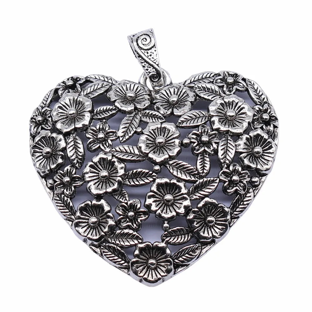 Hollow flower love pendant in ancient silver alloy measuring 67x58mm