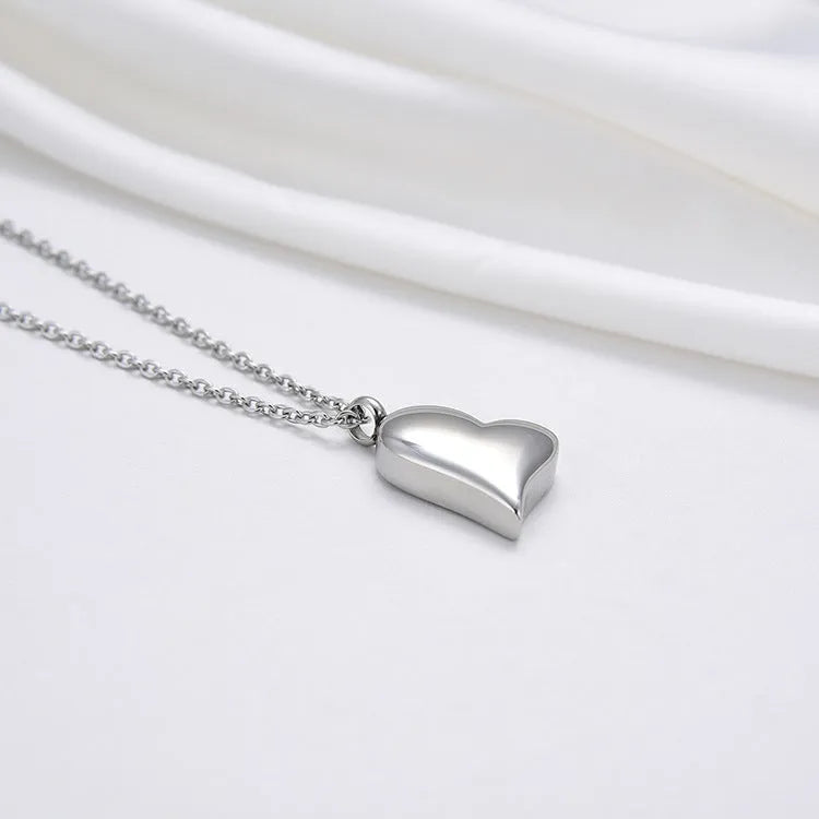 Silver curved peach heart stainless steel pendant necklace on adjustable chain
