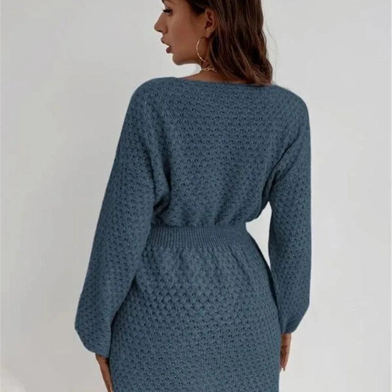 Blue women's knitted dress with hand-crocheted floral details and fitted waist design