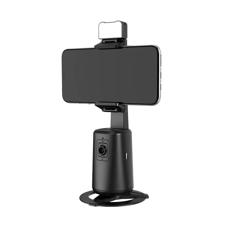 Black desktop phone bracket with intelligent face tracking camera and LED ribbon lights, remote control on desk