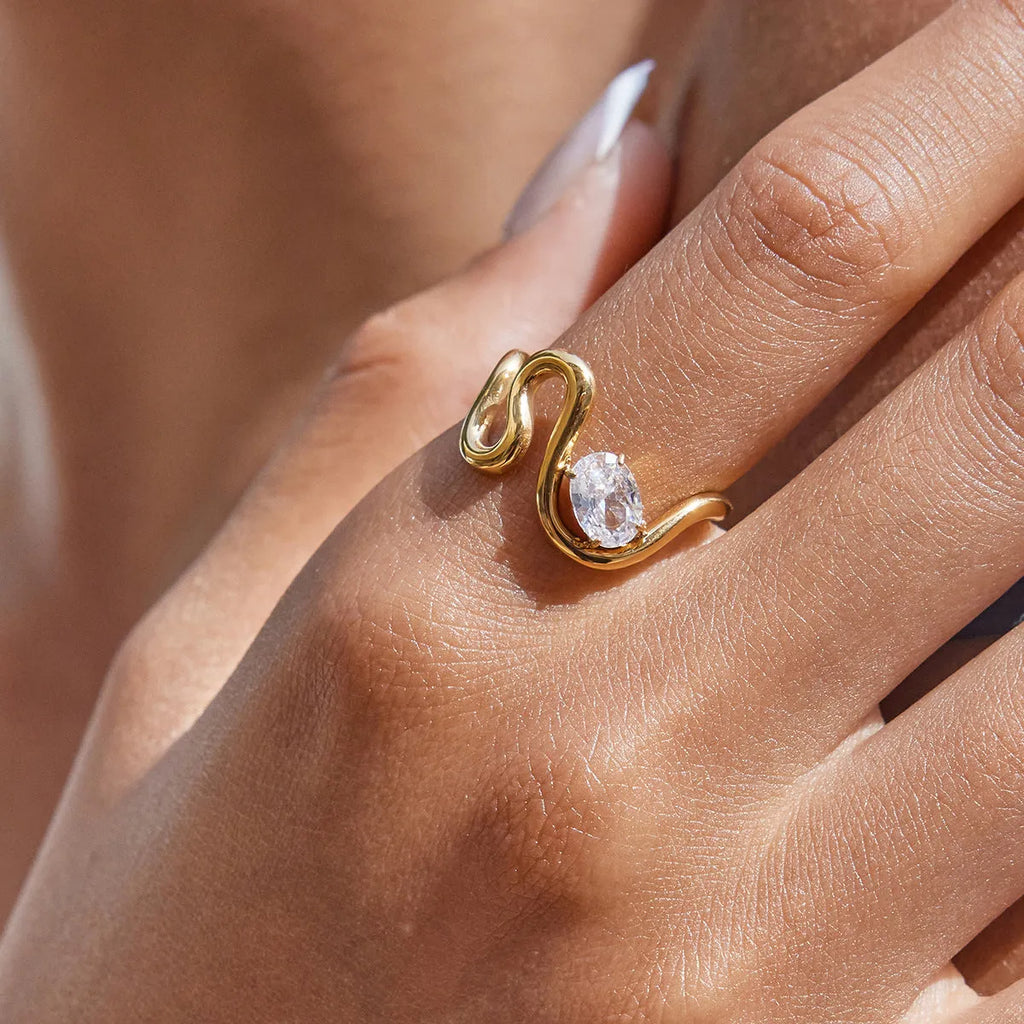 Geometric stainless steel ring with zircon stones in a silver-toned finish.