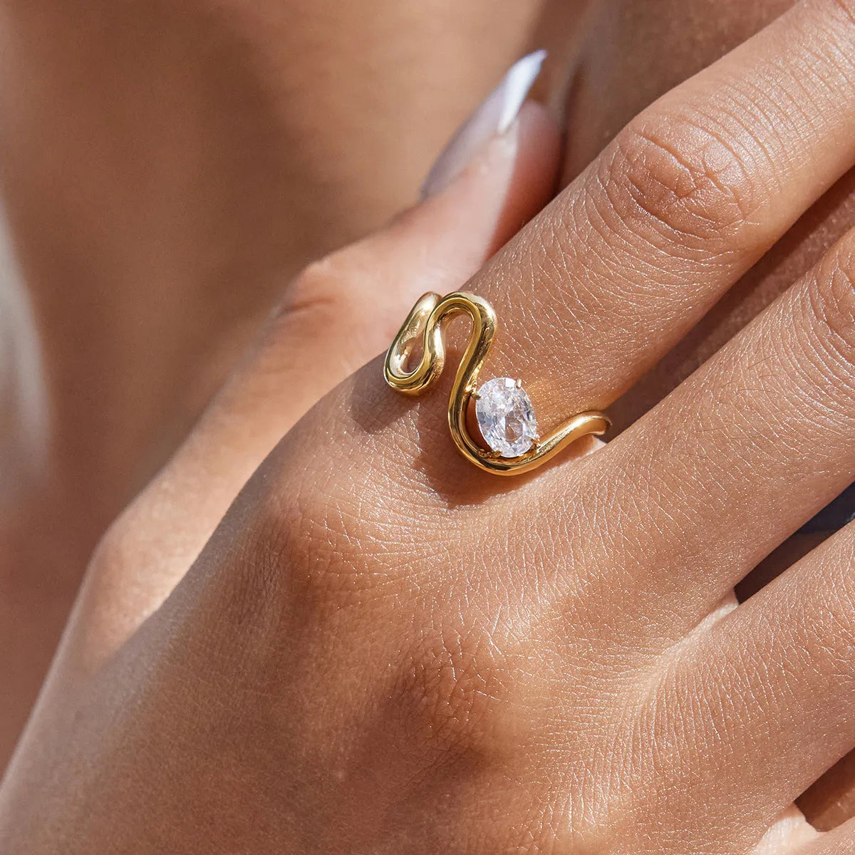 Geometric stainless steel ring with zircon stones in a silver-toned finish.
