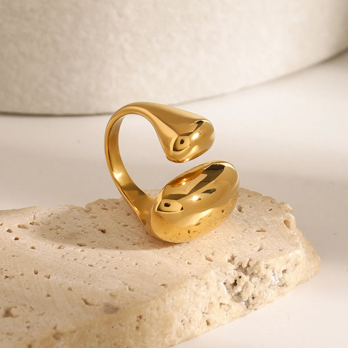 Exaggerated geometric stainless steel open ring for women with electroplated finish.