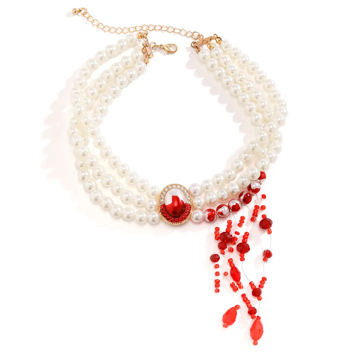 Gold electroplate Halloween pearl collar set with U-shaped necklace, bracelet, and stud earrings on display