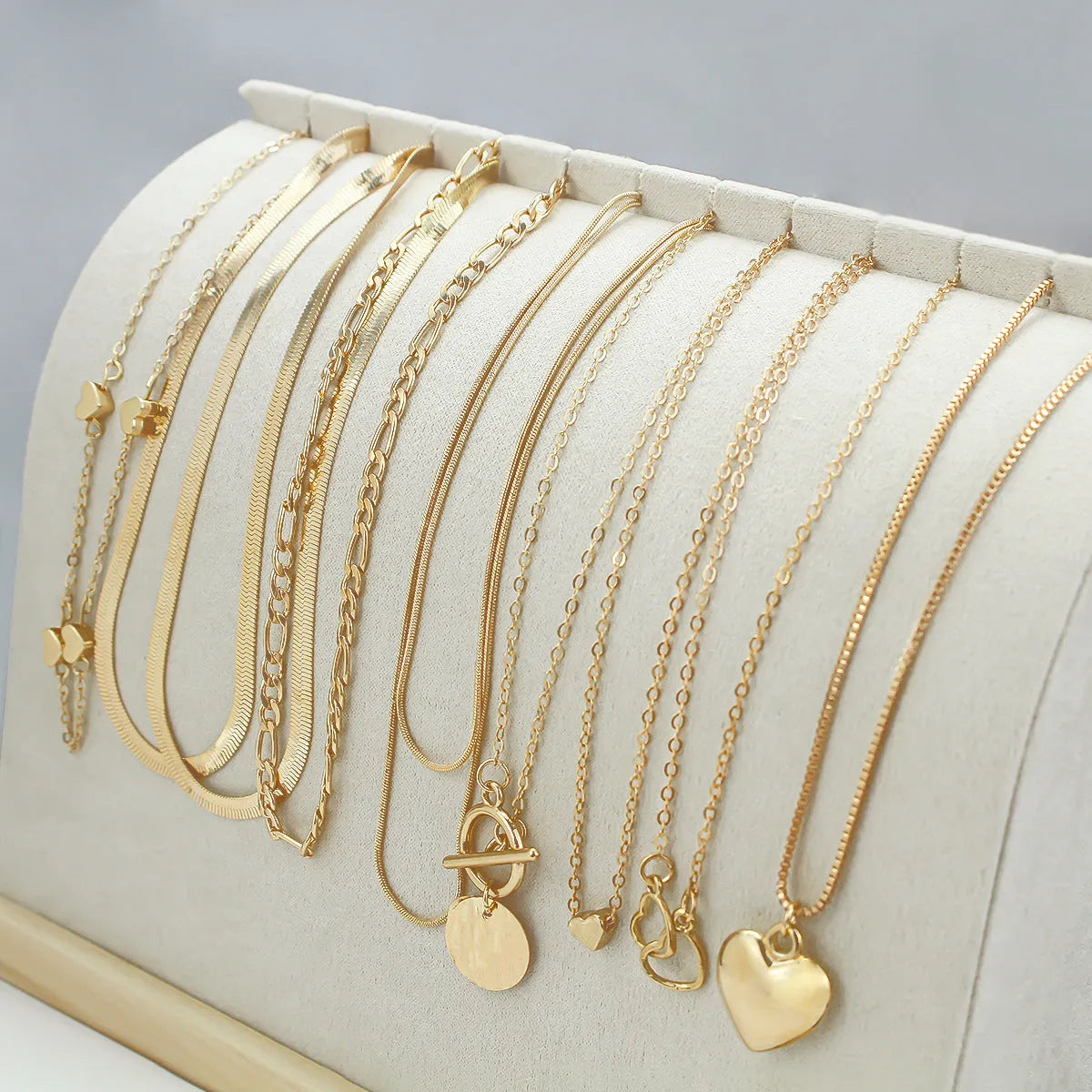 10-piece women's gold electroplated necklace set with adjustable length and snake bone chain design