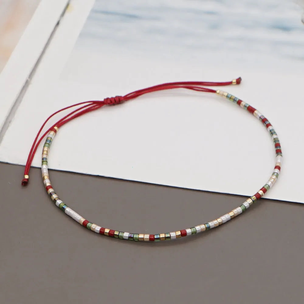 Bohemian style women's bracelet with semi-precious stone and colourful glass beads on adjustable fastening