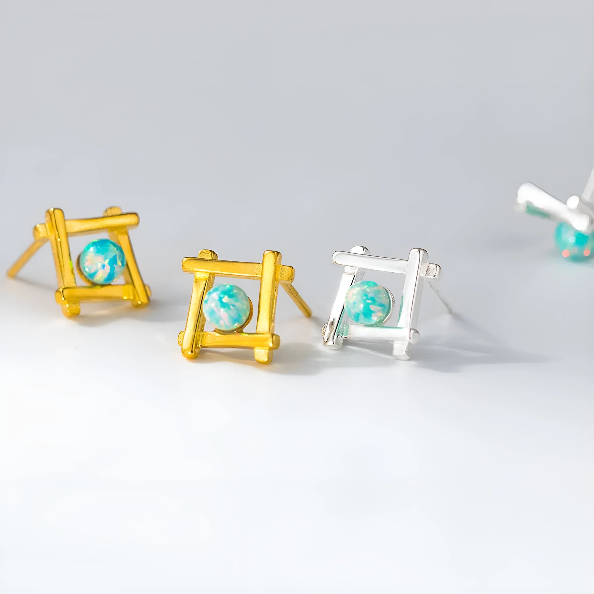 Geometric cross stud earrings in sterling silver with quadrangle shape and butterfly fastenings