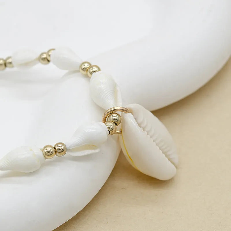 White shell necklace with mother of pearl pendant on regular chain