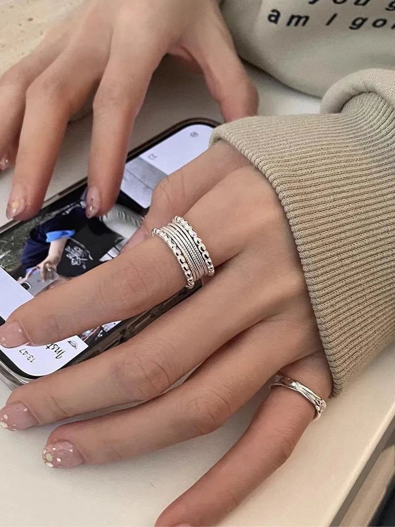 Women's copper alloy ring with woven twisted multilayer geometric design and adjustable opening