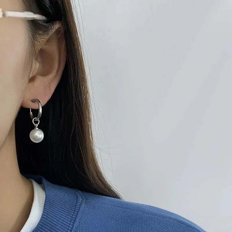 Pearl-coloured geometric round alloy earrings with dangle drop design and titanium steel posts