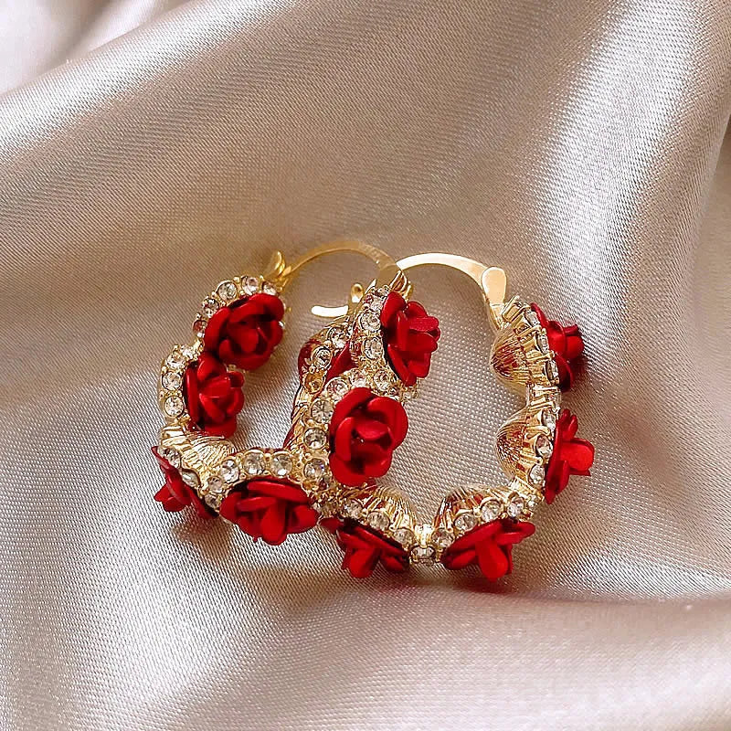 Red alloy clip-on earrings with flower shape and rose-inspired design for women