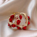 Red alloy clip-on earrings with flower shape and rose-inspired design for women