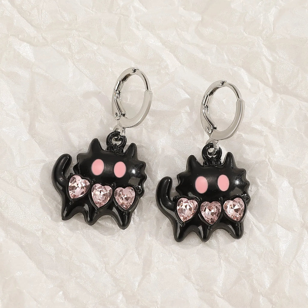 Women's alloy earrings with cross and character designs in five colour options including white cross and antique silver