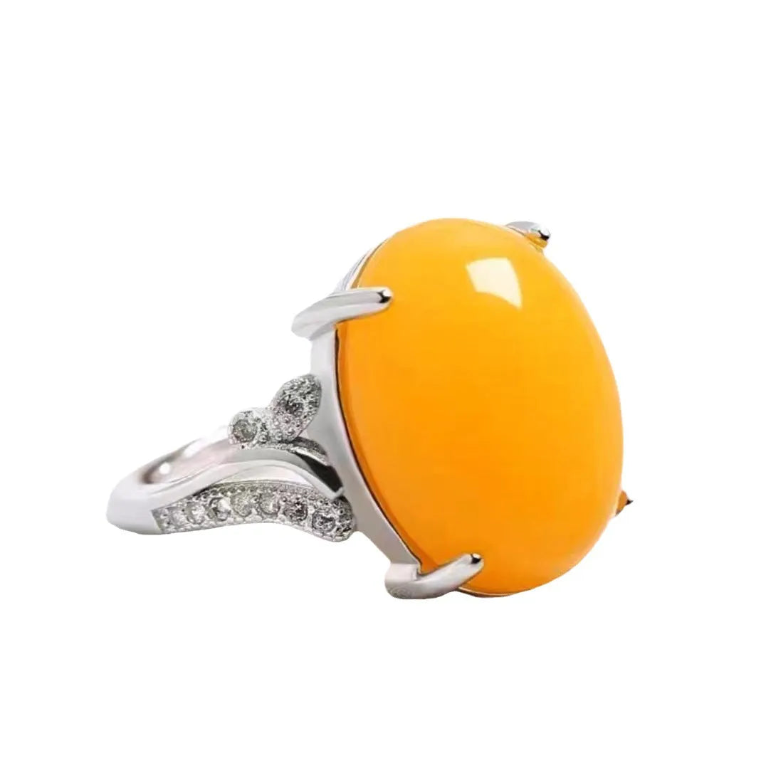 Adjustable geometric sapphire ring in alloy, shown in multiple colour options on a hand.