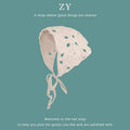 Women's cotton triangular headscarf with floral pattern in a retro French style.
