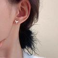 Women's fishtail earrings in white gold colour or yellow gold colour with copper construction
