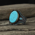 Men's round alloy ring with antique silver finish and turquoise decorative element