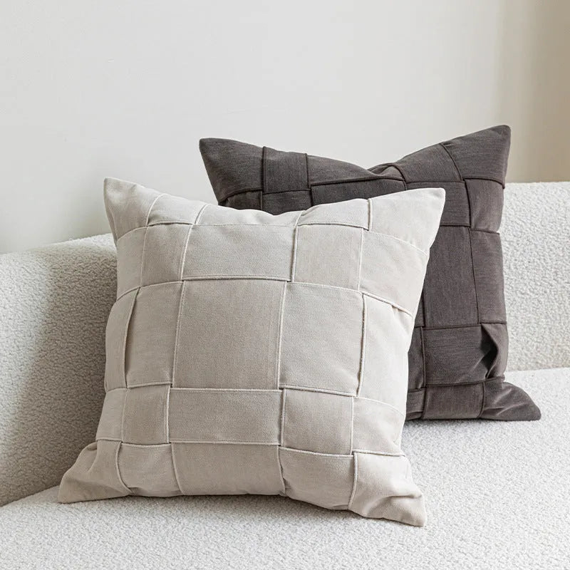 Square chenille woven cushion in a choice of seven colours on a sofa, showing its 50x50cm size and textured fabric.