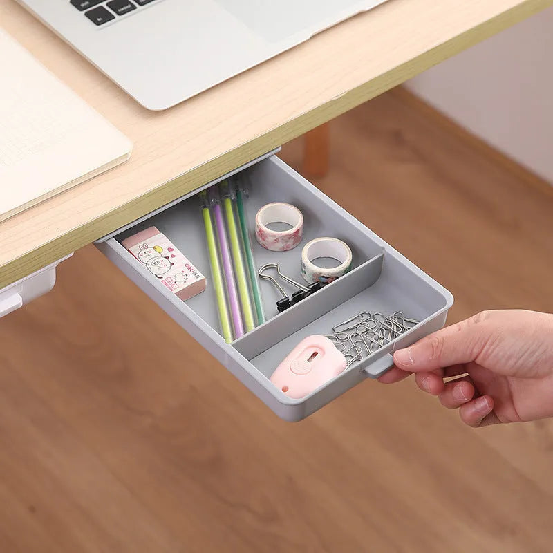 White plastic adhesive storage drawer with cover and internal grid compartments for under-desk organisation