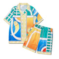 Plaid patterned beach outfit set with short sleeve shirt and matching trousers on a man